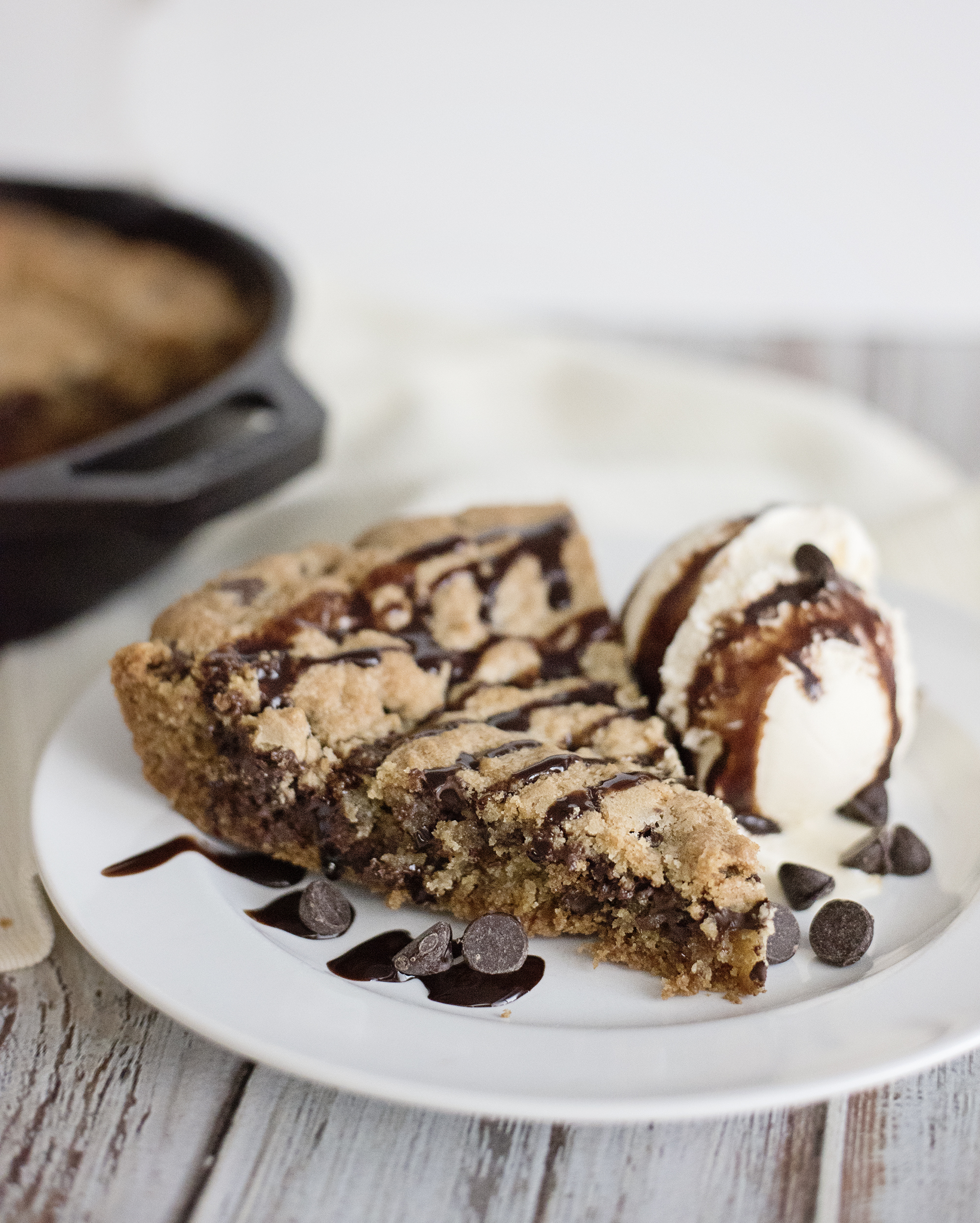 Skillet Cookie Cake - Restaurant Style! This recipe is seriously better than a birthday cake. Moist, delicious and easy to make.